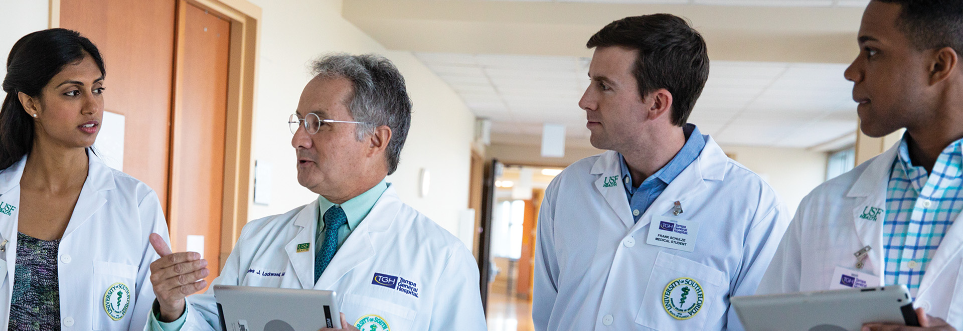 doctors walking down the hallway of the hospital